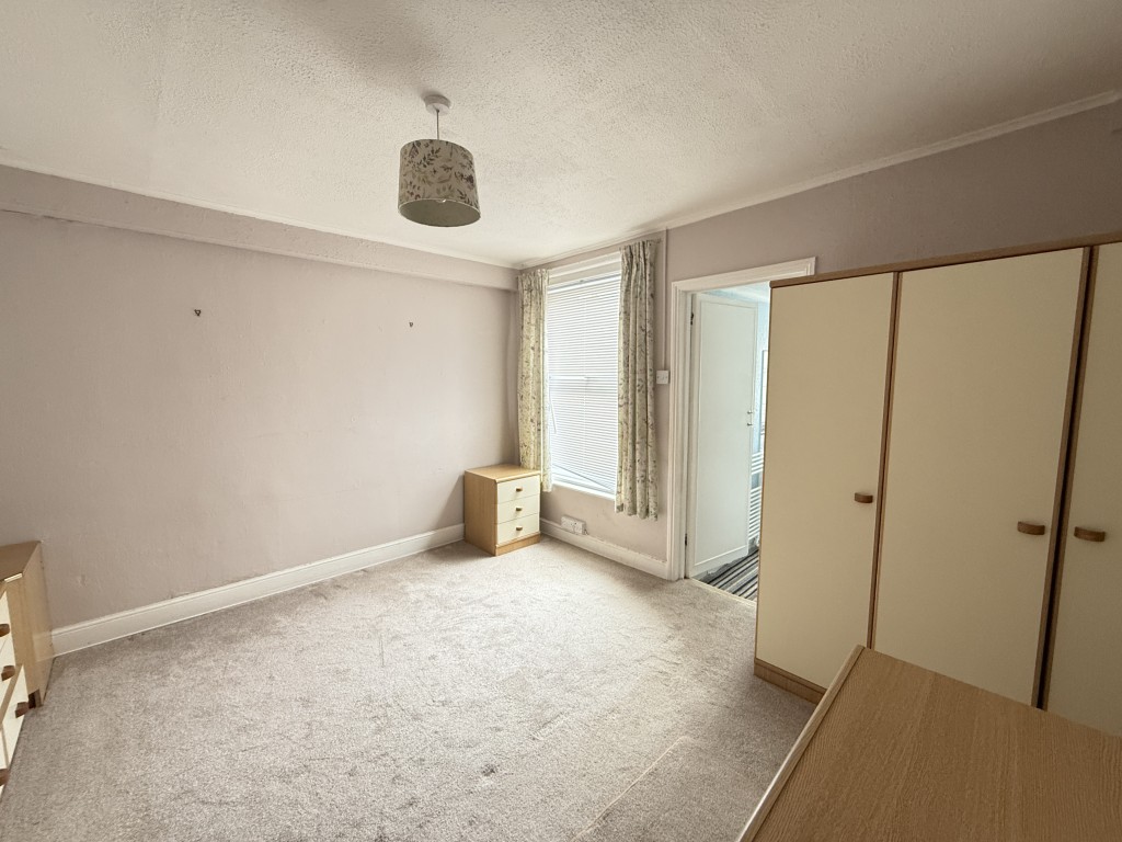 Lot: 142 - FREEHOLD TWO-BEDROOM HOUSE IN NEED OF IMPROVEMENT - Bedroom at rear with bathroom beyond